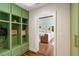 Mudroom boasts built-in green cabinets and drawers for organized storage as you enter the house at 95 Gordon St, Charleston, SC 29403