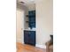 Stylish wet bar featuring custom cabinetry, marble countertop, and unique wallpaper at 95 Gordon St, Charleston, SC 29403
