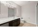 Bright bathroom with a single sink vanity, and toilet at 9711 Tackle St, Ladson, SC 29456