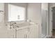 Bright bathroom with a walk-in tub and a separate shower at 9711 Tackle St, Ladson, SC 29456