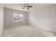 Spacious bedroom with neutral carpeting and a large window for natural light at 9711 Tackle St, Ladson, SC 29456