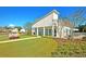 Charming clubhouse with manicured lawn and landscaping in a Gathering-friendly community at 9711 Tackle St, Ladson, SC 29456