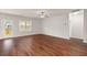 Expansive living room features hardwood flooring, a ceiling fan, and lots of natural light at 9711 Tackle St, Ladson, SC 29456