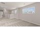 Upstairs loft area with plush carpeting and plenty of natural light at 9711 Tackle St, Ladson, SC 29456