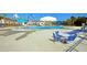 Community pool with splash pad, lounge seating, and shade umbrellas at 9711 Tackle St, Ladson, SC 29456