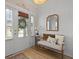 Inviting entryway features a decorative mirror, bench seating, and plank accent wall at 1004 Saltwater Cir, Johns Island, SC 29455