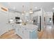 Bright kitchen features stainless appliances, white cabinetry, and a center island at 1004 Saltwater Cir, Johns Island, SC 29455