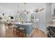 Modern white kitchen featuring stainless steel appliances, quartz countertops, and herringbone backsplash at 1004 Saltwater Cir, Johns Island, SC 29455