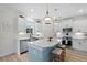 Well-appointed kitchen featuring a center island with seating, stainless steel appliances, and a stylish backsplash at 1004 Saltwater Cir, Johns Island, SC 29455