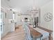 Spacious open-concept kitchen and dining area featuring a large island and stylish lighting at 1004 Saltwater Cir, Johns Island, SC 29455