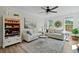 Cozy living room with stylish decor, a ceiling fan, and plenty of natural light at 1004 Saltwater Cir, Johns Island, SC 29455