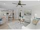 Inviting living room with neutral decor, a ceiling fan, and views into the dining and kitchen areas at 1004 Saltwater Cir, Johns Island, SC 29455