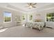 Bright main bedroom with three windows, trey ceiling, and matching furniture at 1004 Saltwater Cir, Johns Island, SC 29455
