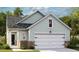 Charming single-Gathering home featuring a two-car garage and stone accents on the lower exterior at 1019 Sagegrass St, Summerville, SC 29485