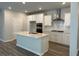 Spacious kitchen featuring stainless steel appliances, a large island, and plenty of cabinet space at 1035 Tulip St, Summerville, SC 29485
