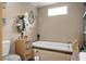 Bathroom with a deep soaking tub, toilet, storage, and a window for natural light at 1051 Cooper Store Rd, Moncks Corner, SC 29461