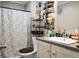 Cozy bathroom featuring a vanity, toilet, and a shower with a patterned curtain at 1051 Cooper Store Rd, Moncks Corner, SC 29461