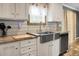 Kitchen featuring modern appliances, light wood countertops, stainless steel sink, and white cabinets at 1051 Cooper Store Rd, Moncks Corner, SC 29461