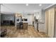 Eat-in kitchen with stainless appliances, center island and hard surface countertops, leading into the living room at 1051 Cooper Store Rd, Moncks Corner, SC 29461