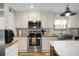 Bright kitchen with stainless steel appliances, light countertops, and white cabinets at 1051 Cooper Store Rd, Moncks Corner, SC 29461