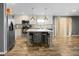 The kitchen boasts stainless appliances, a center island with counter seating and an open layout at 1051 Cooper Store Rd, Moncks Corner, SC 29461