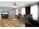 Welcoming living room featuring wood-look floors and TV on an entertainment center at 1051 Cooper Store Rd, Moncks Corner, SC 29461