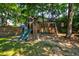 Spacious backyard featuring a wooden play set with slides and swings, creating a fun and engaging outdoor space at 1076 Hatfield St, North Charleston, SC 29405