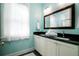 Clean bathroom with double sink vanity, granite countertop, and sleek modern fixtures at 1076 Hatfield St, North Charleston, SC 29405