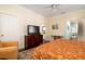 Spacious bedroom shows television, hardwood floors and access to bathroom at 1076 Hatfield St, North Charleston, SC 29405