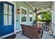 Inviting front porch with comfortable seating, a ceiling fan, and charming exterior details at 1076 Hatfield St, North Charleston, SC 29405