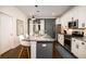 Modern kitchen features granite countertops, stainless steel appliances, and island with barstool seating at 1076 Hatfield St, North Charleston, SC 29405