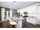 Modern kitchen featuring stainless steel appliances, granite countertops, and a stylish breakfast bar at 1076 Hatfield St, North Charleston, SC 29405