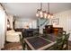 Open-concept living room with dining area featuring hardwood floors and abundant natural light at 1076 Hatfield St, North Charleston, SC 29405