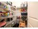 A well-organized walk-in pantry with metal shelving filled with goods to maximize storage and convenience at 1076 Hatfield St, North Charleston, SC 29405