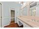 Bright bathroom featuring double sinks and a large mirror at 108 Woodlake Dr, Summerville, SC 29485