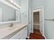 Bathroom features a marble countertop, large mirror, and entry to walk-in closet at 108 Woodlake Dr, Summerville, SC 29485