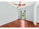 Inviting bedroom with hardwood floors, a ceiling fan, and a serene window view at 108 Woodlake Dr, Summerville, SC 29485