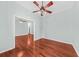 Bright bedroom featuring hardwood floors, ceiling fan, and an open doorway at 108 Woodlake Dr, Summerville, SC 29485