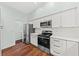 Bright kitchen boasts white cabinets, stainless steel appliances, and modern finishes at 108 Woodlake Dr, Summerville, SC 29485