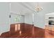 Open-concept living room featuring hardwood floors, ceiling fan, and abundant natural light at 108 Woodlake Dr, Summerville, SC 29485