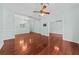 Bright living room showcasing hardwood floors, ceiling fan, and open layout at 108 Woodlake Dr, Summerville, SC 29485