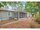 Private backyard with screened porch, garden area, and lots of shade at 109 Willow Ct, Summerville, SC 29486