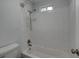 Bright bathroom featuring a tiled shower-over-bath, white subway tiles, and coordinated fixtures at 109 Willow Ct, Summerville, SC 29486