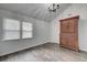 Sun-filled room with hardwood flooring, a large window, vaulted ceiling and wooden armoire at 109 Willow Ct, Summerville, SC 29486