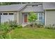 The home has mature landscaping, a metal roof, and an attached garage at 109 Willow Ct, Summerville, SC 29486