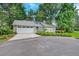 Charming home exterior with driveway, landscaping, garage and a metal roof at 109 Willow Ct, Summerville, SC 29486