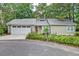 Charming home exterior with driveway, landscaping, garage and a metal roof at 109 Willow Ct, Summerville, SC 29486