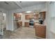 Spacious kitchen featuring stainless steel appliances, granite countertops, and wood-look tile flooring at 109 Willow Ct, Summerville, SC 29486