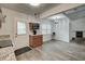 Open kitchen with granite countertops and stainless steel appliances adjacent to the dining area and fireplace at 109 Willow Ct, Summerville, SC 29486