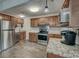 The kitchen has stainless steel appliances, granite countertops, and tile floors at 109 Willow Ct, Summerville, SC 29486
